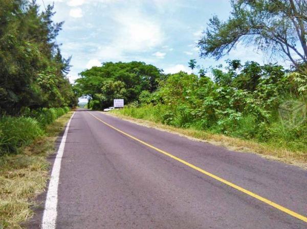 Terreno frente carretera agua luz chivato escritur